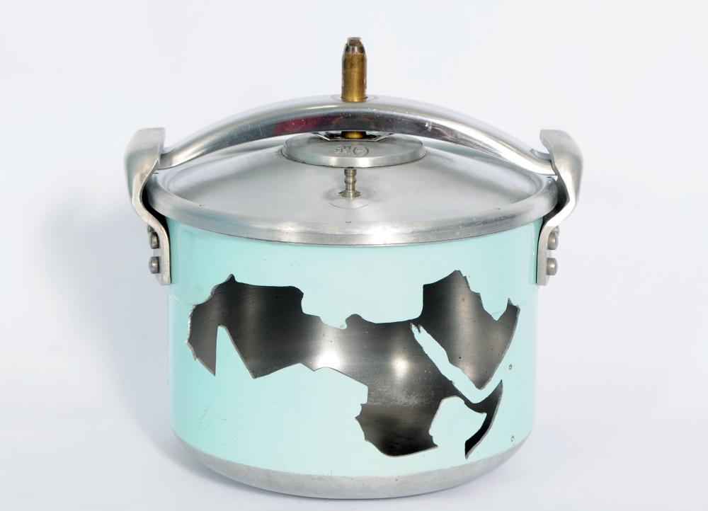 artwork of a pressure cooker with an image of North Africa depicted on the front