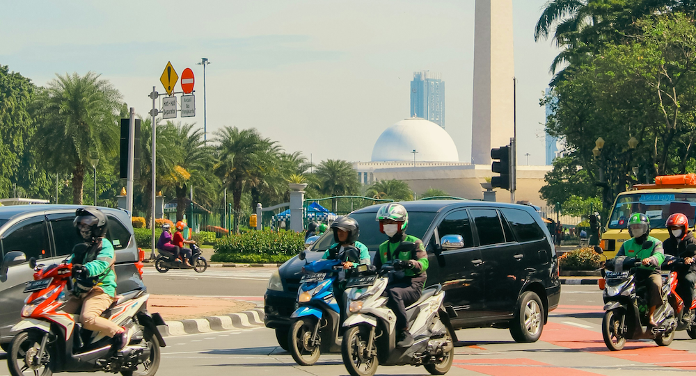 Grab Bike Driver picking up passenger