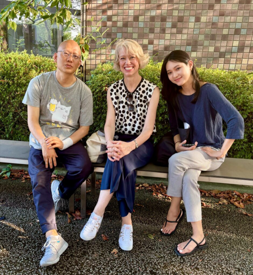 Three people on a bench