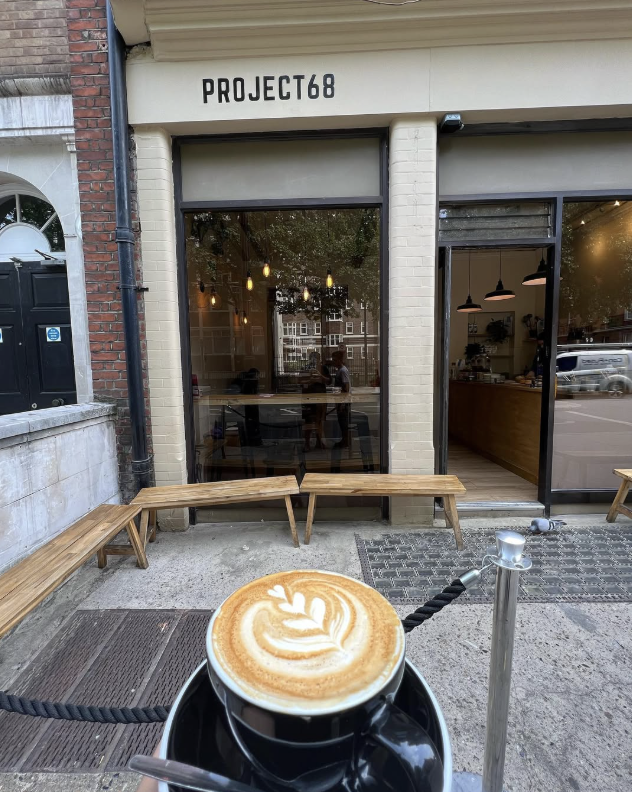 A latte in front of Project 68 coffee shop